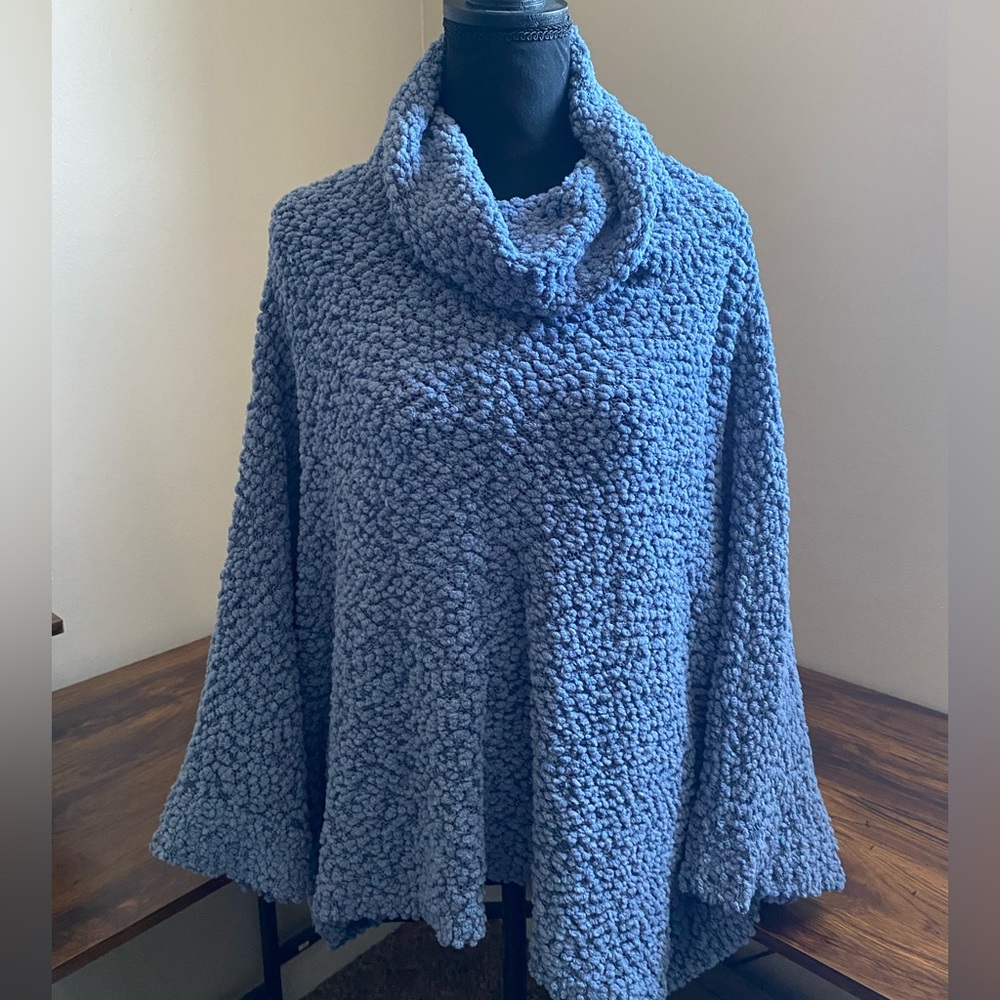 Super cute with jeans and boots! A medium oversized sweater. Super Comfortable!